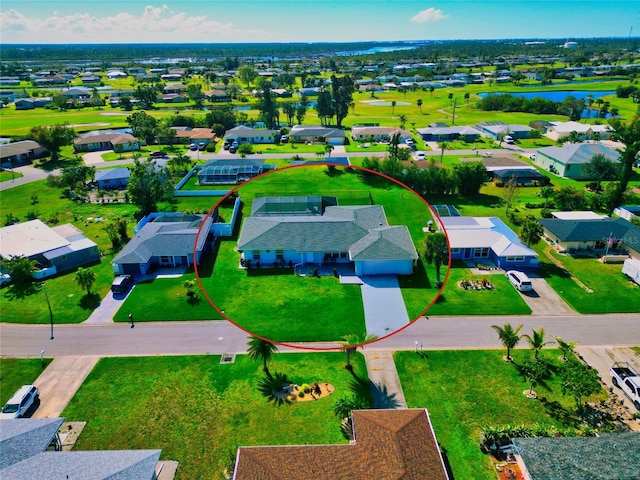 drone / aerial view with a water view and a residential view