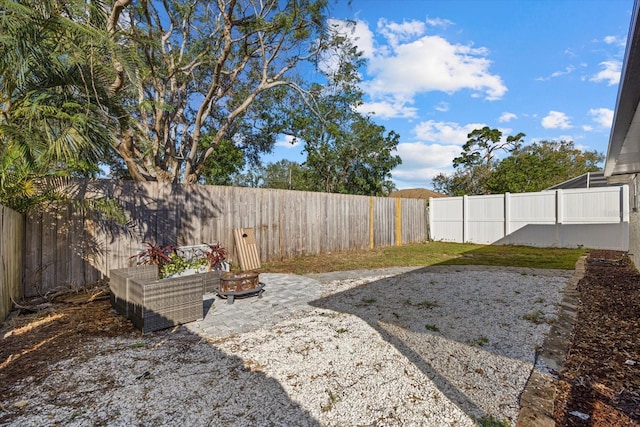 view of yard featuring a patio area and a fenced backyard