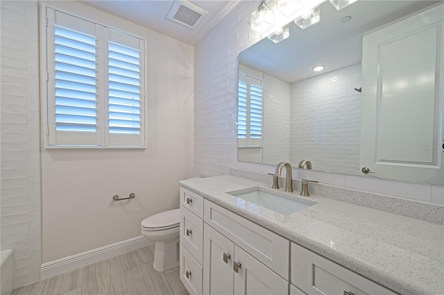 full bath featuring toilet, visible vents, walk in shower, and vanity