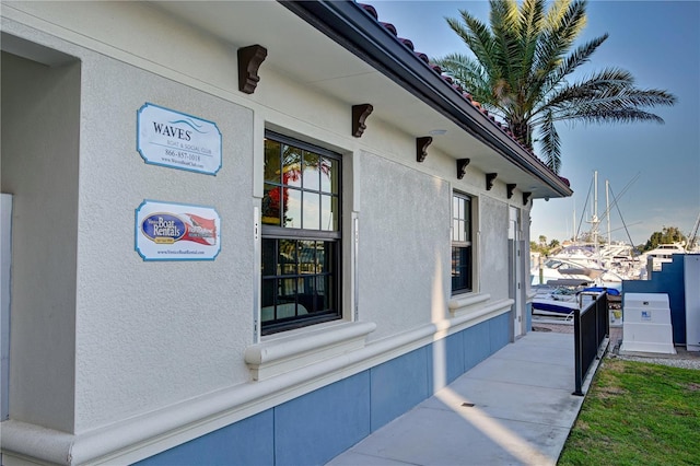 view of side of property with stucco siding