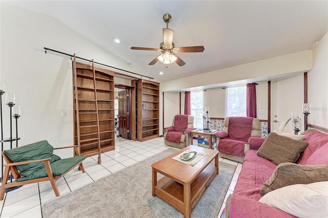 living room with lofted ceiling, recessed lighting, a barn door, ceiling fan, and tile patterned flooring