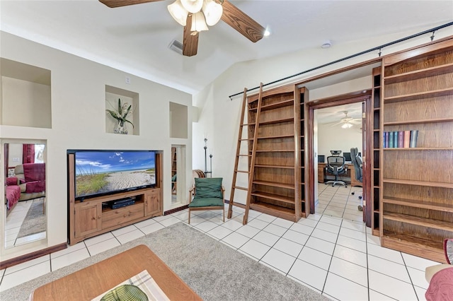 living room with ceiling fan, visible vents, vaulted ceiling, and tile patterned floors