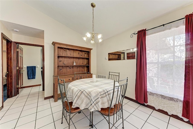 dining room with lofted ceiling, light tile patterned floors, a chandelier, and visible vents