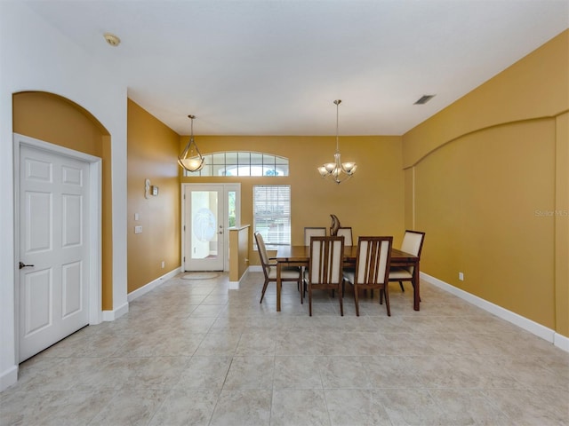 dining room featuring baseboards, visible vents, a notable chandelier, and french doors