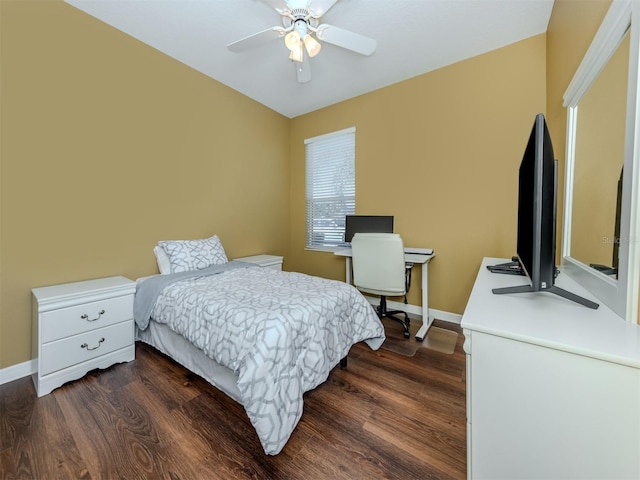 bedroom with dark wood-style floors, baseboards, and a ceiling fan