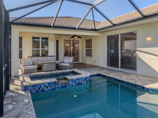 view of swimming pool featuring a pool with connected hot tub, a patio area, an outdoor living space, and a ceiling fan