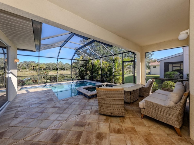 pool with a lanai, a patio, and a hot tub