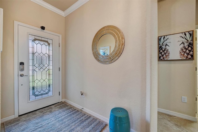 foyer entrance with crown molding and baseboards