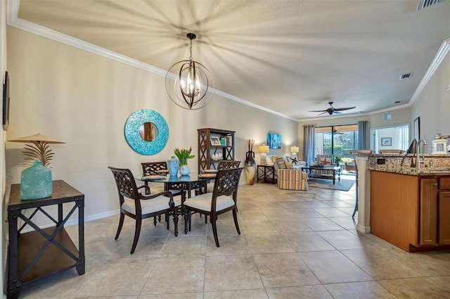 dining area with visible vents, crown molding, baseboards, and light tile patterned floors