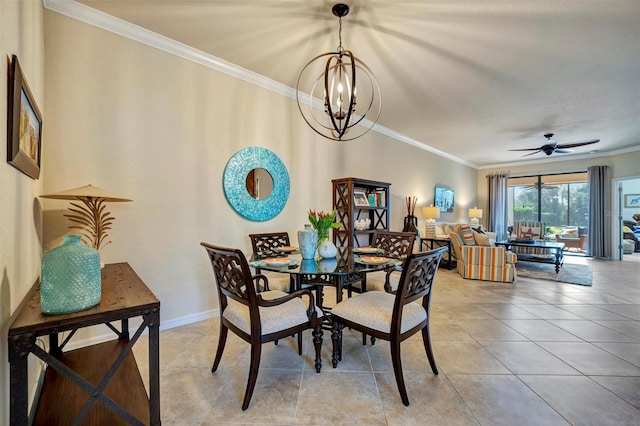 dining space featuring tile patterned flooring, ornamental molding, baseboards, and ceiling fan with notable chandelier