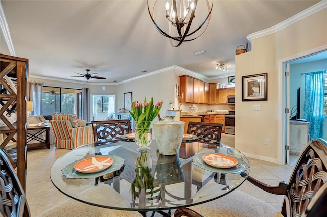 dining space featuring ceiling fan with notable chandelier, crown molding, baseboards, and light tile patterned floors