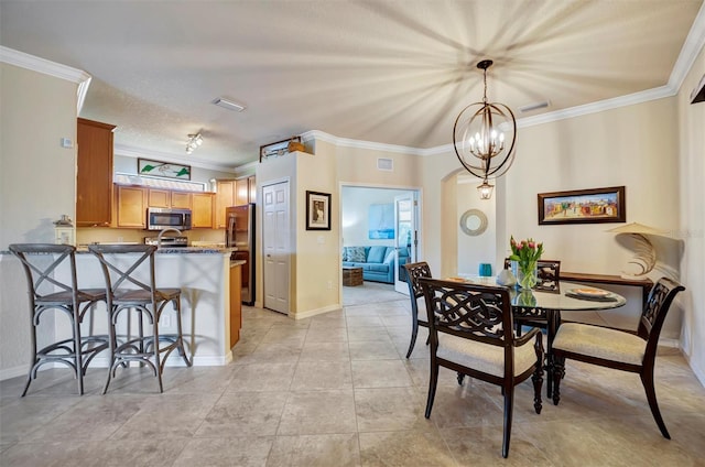 dining room with visible vents, ornamental molding, and baseboards