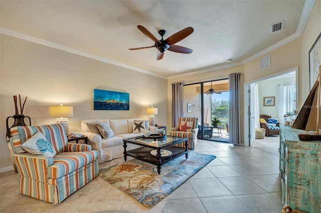 tiled living room featuring a ceiling fan, visible vents, a textured ceiling, and ornamental molding