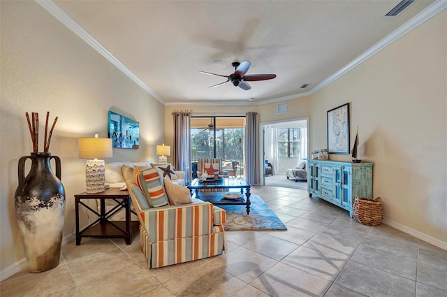 tiled living room featuring ornamental molding, visible vents, baseboards, and a ceiling fan