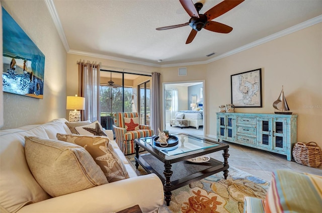 living room with visible vents, crown molding, and tile patterned floors