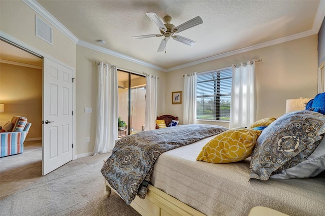 bedroom featuring a textured ceiling, carpet floors, visible vents, access to outside, and crown molding