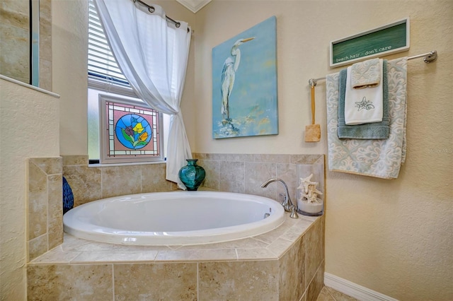 full bathroom with a garden tub and a textured wall