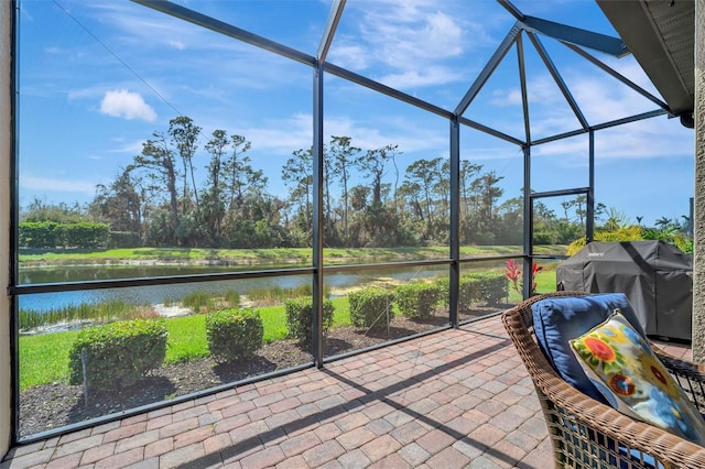 unfurnished sunroom with a water view