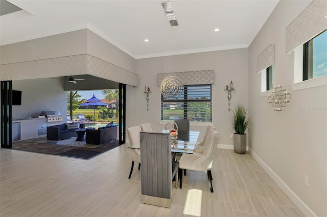 dining room with ceiling fan, baseboards, crown molding, and recessed lighting