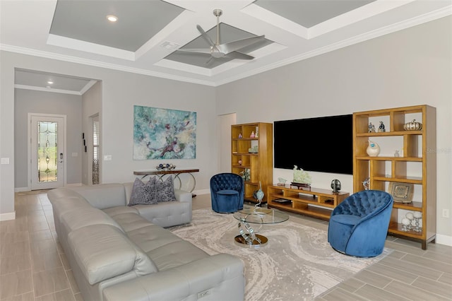 living area featuring ceiling fan, ornamental molding, coffered ceiling, and baseboards