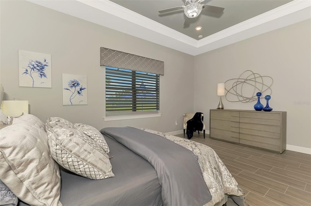 bedroom with baseboards, ceiling fan, ornamental molding, wood finish floors, and recessed lighting