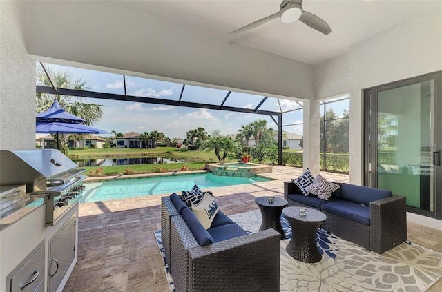 view of swimming pool with a patio, a grill, ceiling fan, exterior kitchen, and a lanai