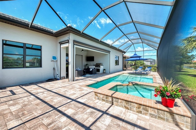 view of swimming pool with area for grilling, glass enclosure, a patio area, and a pool with connected hot tub