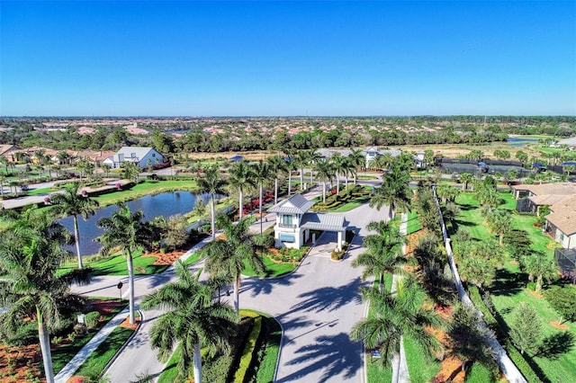 drone / aerial view with a water view and a residential view