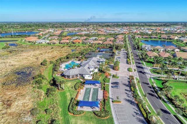 birds eye view of property featuring a residential view and a water view