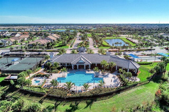 birds eye view of property with a water view