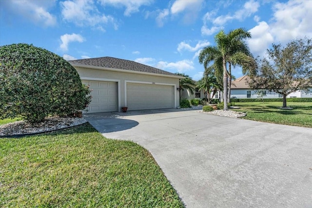 ranch-style home with an attached garage, concrete driveway, a front yard, and stucco siding