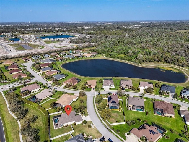 bird's eye view with a residential view and a water view