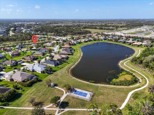 birds eye view of property featuring a water view and a residential view