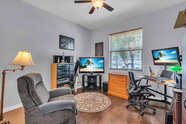 office featuring ceiling fan, wood finished floors, and baseboards