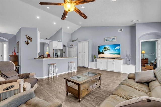 living room with arched walkways, recessed lighting, visible vents, ceiling fan, and high vaulted ceiling