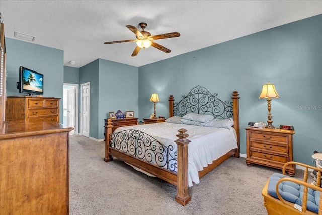 bedroom with carpet floors, a closet, visible vents, and baseboards