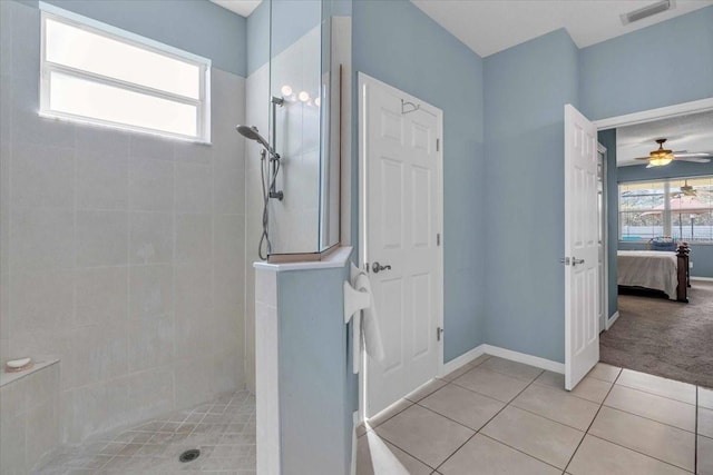 full bath featuring a walk in shower, visible vents, baseboards, tile patterned floors, and ensuite bath