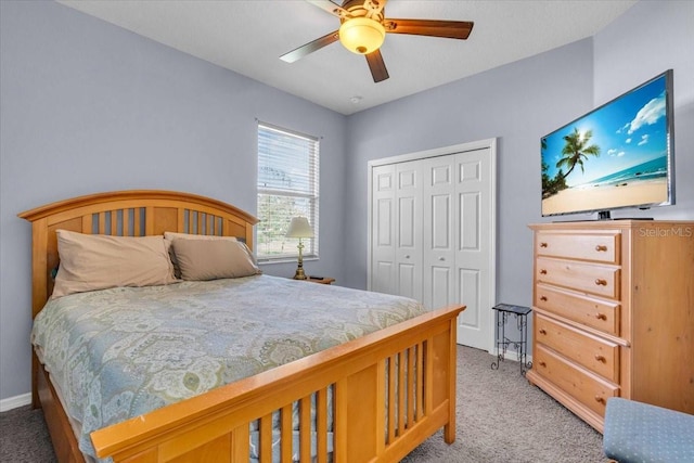 bedroom with light carpet, ceiling fan, and a closet