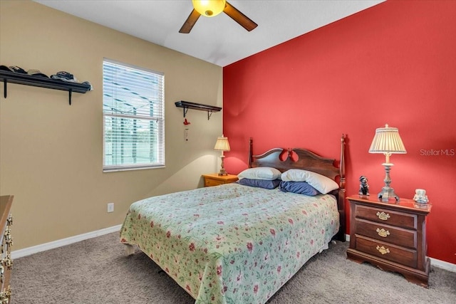 carpeted bedroom with a ceiling fan and baseboards