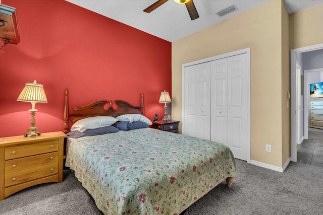 carpeted bedroom featuring a ceiling fan, baseboards, visible vents, and a closet