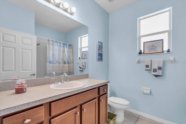 full bath featuring a shower with shower curtain, toilet, vanity, tile patterned flooring, and baseboards