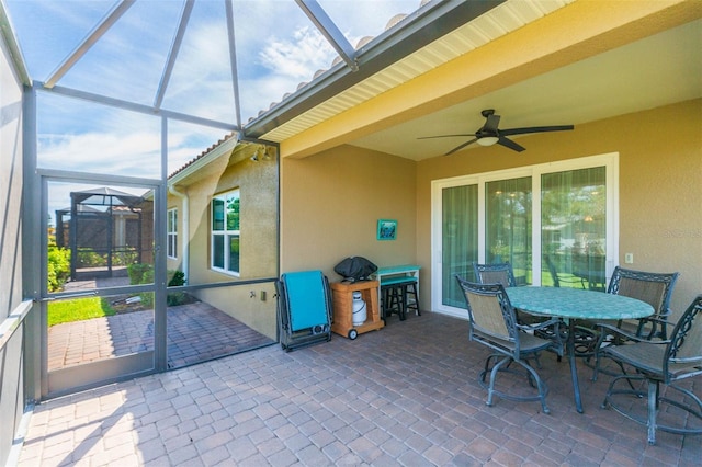 sunroom / solarium with ceiling fan