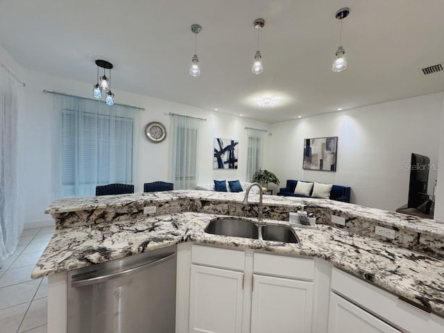 kitchen featuring light tile patterned floors, visible vents, dishwasher, open floor plan, and a sink