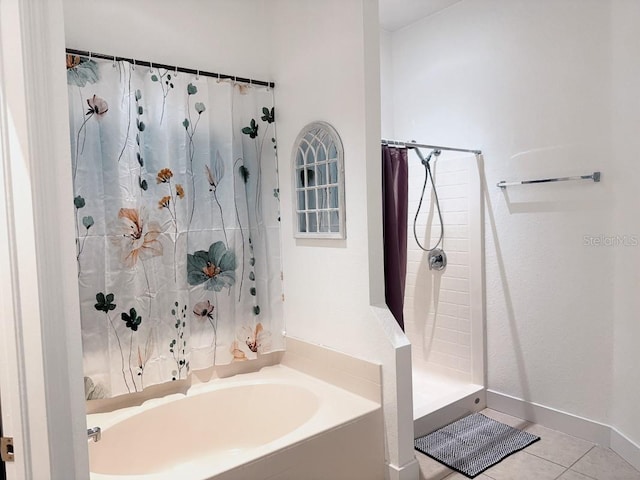 3650 S Sumter Blvd, North Port, FL 34287 - full bath with curtained shower, tile patterned flooring, a bath, and baseboards