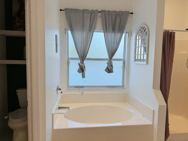 3650 S Sumter Blvd, North Port, FL 34287 - full bath featuring healthy amount of natural light, toilet, a garden tub, and a shower stall