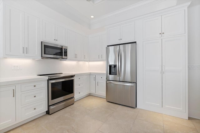 kitchen featuring light countertops, white cabinets, crown molding, and stainless steel appliances