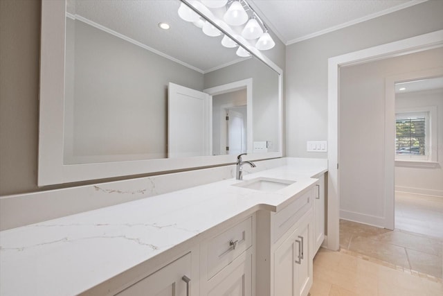 bathroom featuring recessed lighting, baseboards, vanity, and crown molding