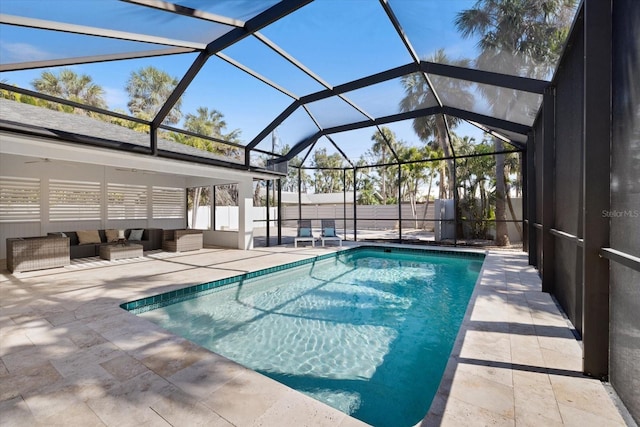 view of swimming pool with a fenced in pool, fence, glass enclosure, outdoor lounge area, and a patio area