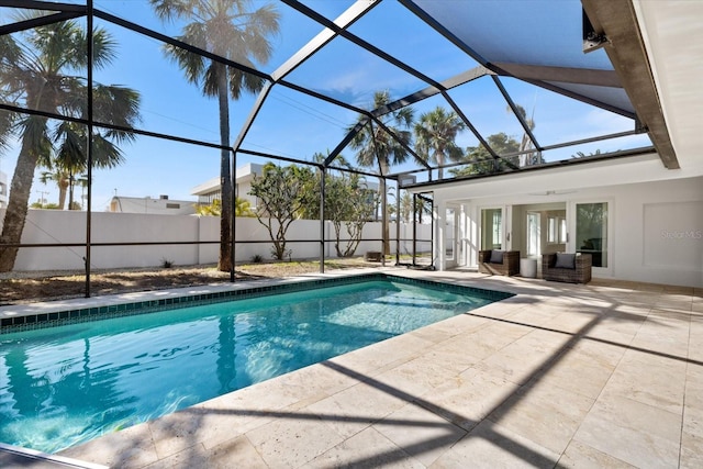 view of pool featuring a lanai, a fenced in pool, a patio, and fence