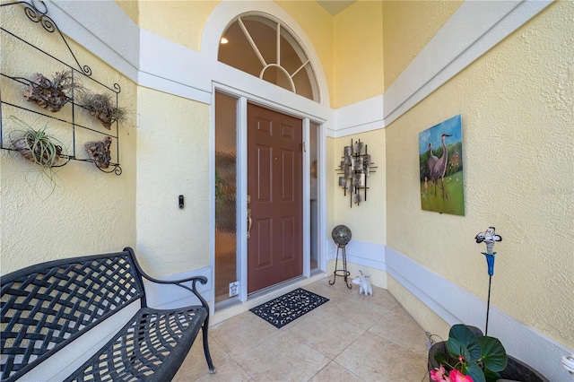 entrance to property with stucco siding